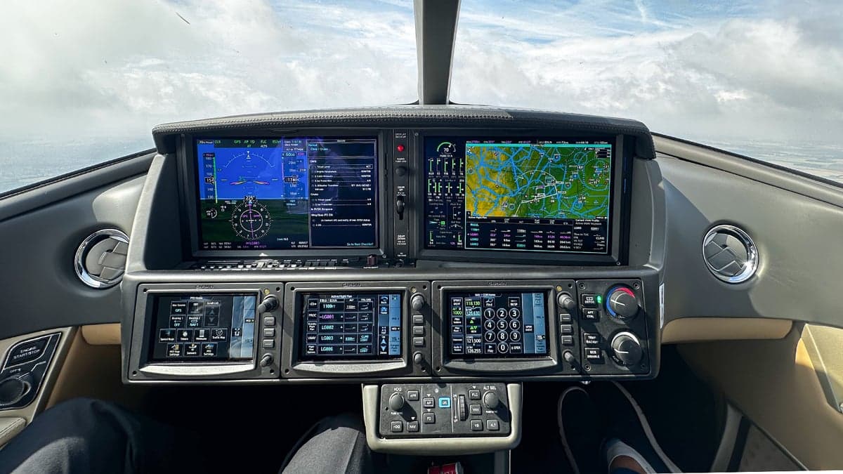 The cockpit of the Cirrus Vision Jet features a modern glass panel with navigation displays.