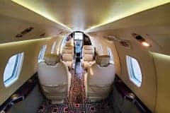 View down the aisle of the cabin of a Cessna Citation CJ3+.