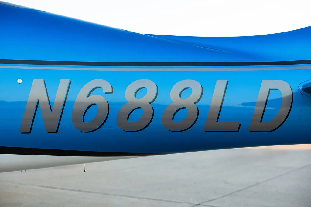 A close-up view of the N688LD registration number on the blue fuselage of the aircraft.