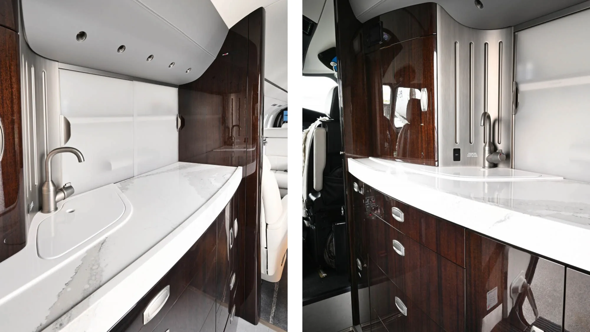 The aircraft's galley features white countertops, sinks, and dark wood cabinetry.
