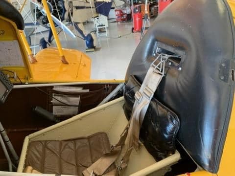 Close-up of the cockpit seat and interior of the aircraft.