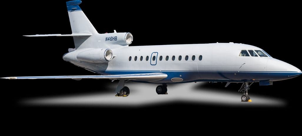 A white and blue Dassault Falcon jet is shown against a black background.