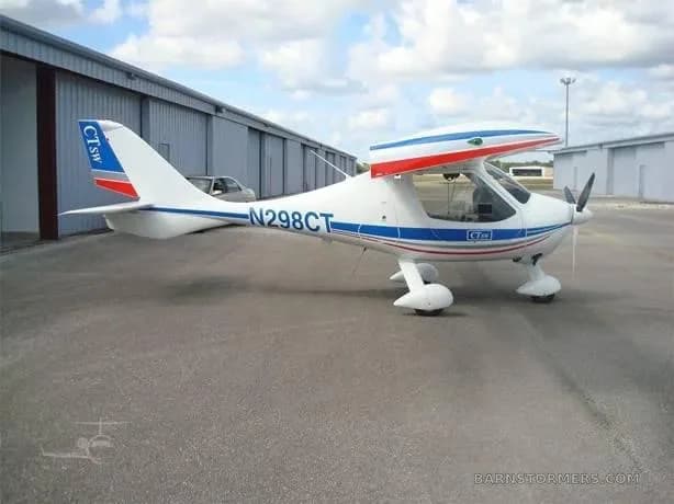 A white and blue Flight Design CTLS light sport aircraft, registration N298CT, parked on an airfield tarmac.