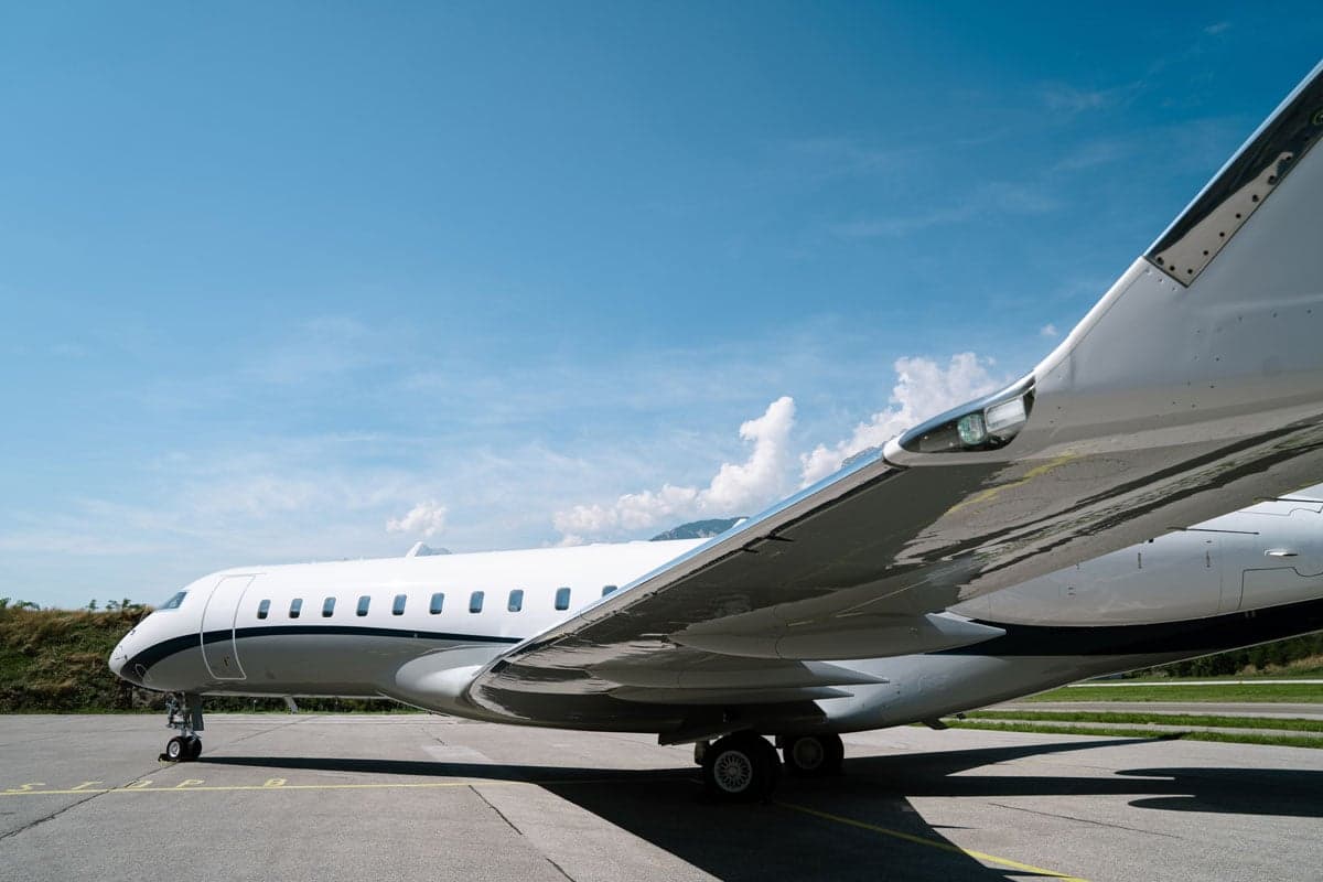 A low angle view of the side of a Bombardier Global XRS aircraft.