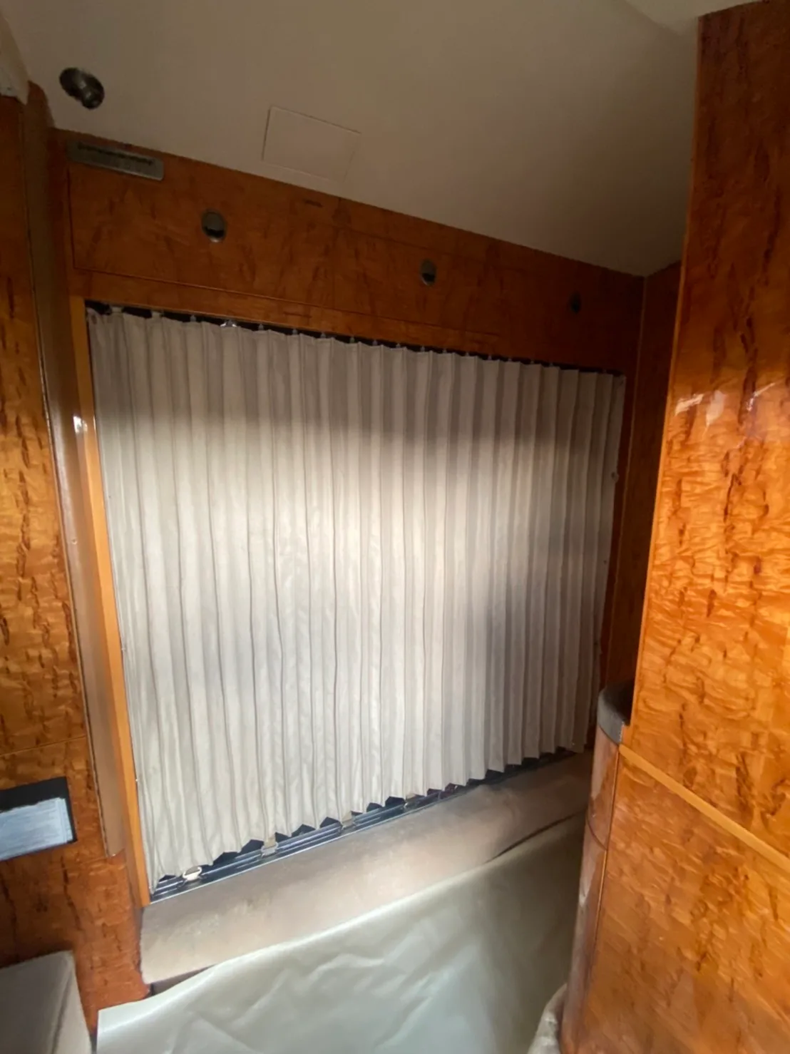 Interior view of the aircraft cabin with a curtain.