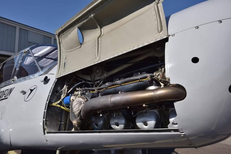 Close-up of the aircraft engine with the cowling open.
