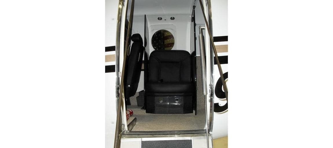 View of the interior of a Beechcraft King Air cabin from the doorway.