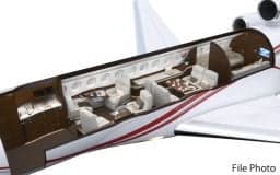 Cutaway view of the Falcon jet's interior, showcasing the seating and layout.