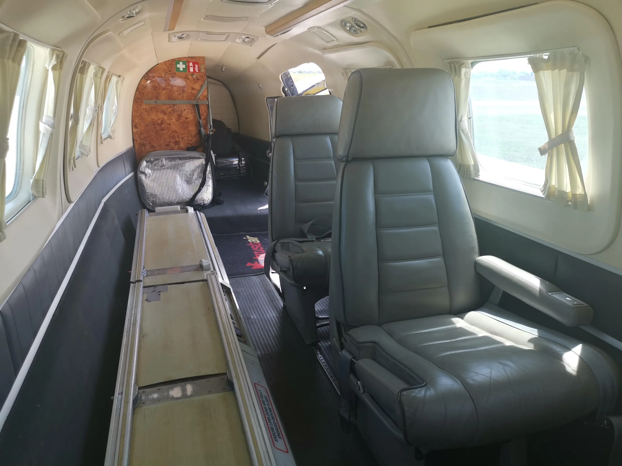View of the interior cabin with seats and cargo area.