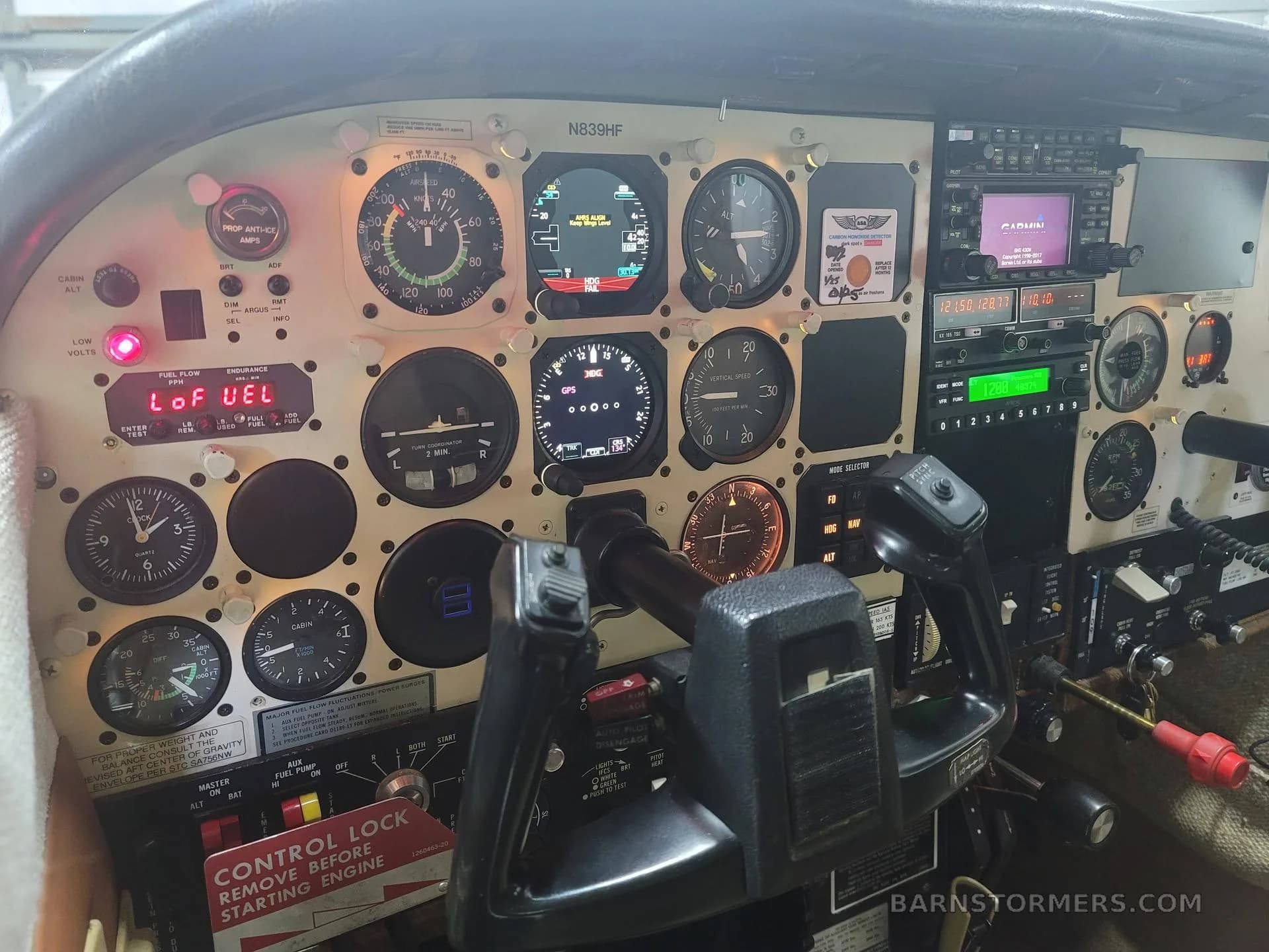 The cockpit instrument panel of the aircraft, featuring analog gauges and digital displays.