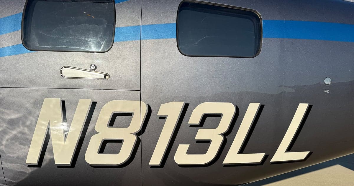 Close-up of the tail number N813LL on the side of an aircraft.