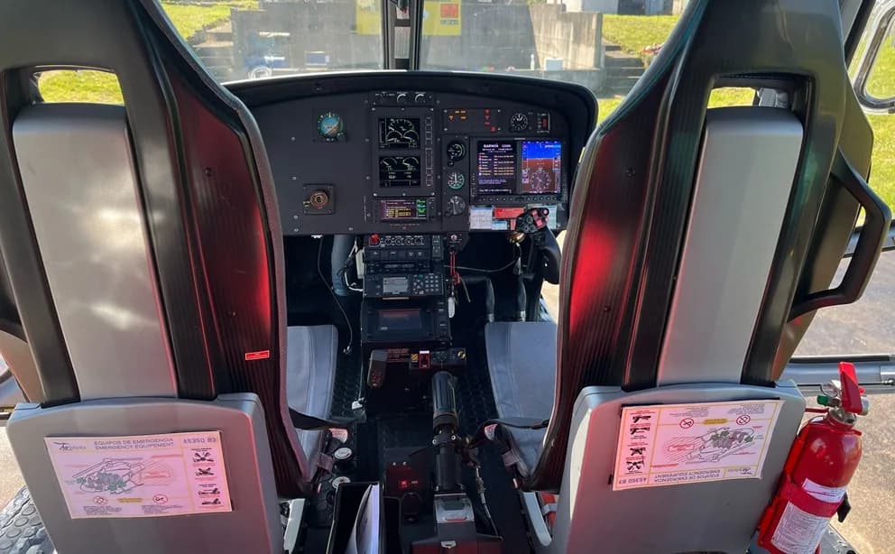 View of the helicopter cockpit from the rear seats.