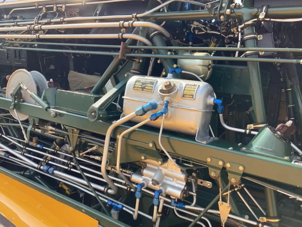 Close-up of the internal components and plumbing inside the T-6 Texan's fuselage.