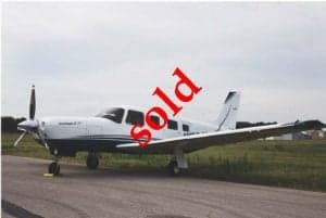A Piper Saratoga II TC aircraft parked on the tarmac with a 'SOLD' overlay.
