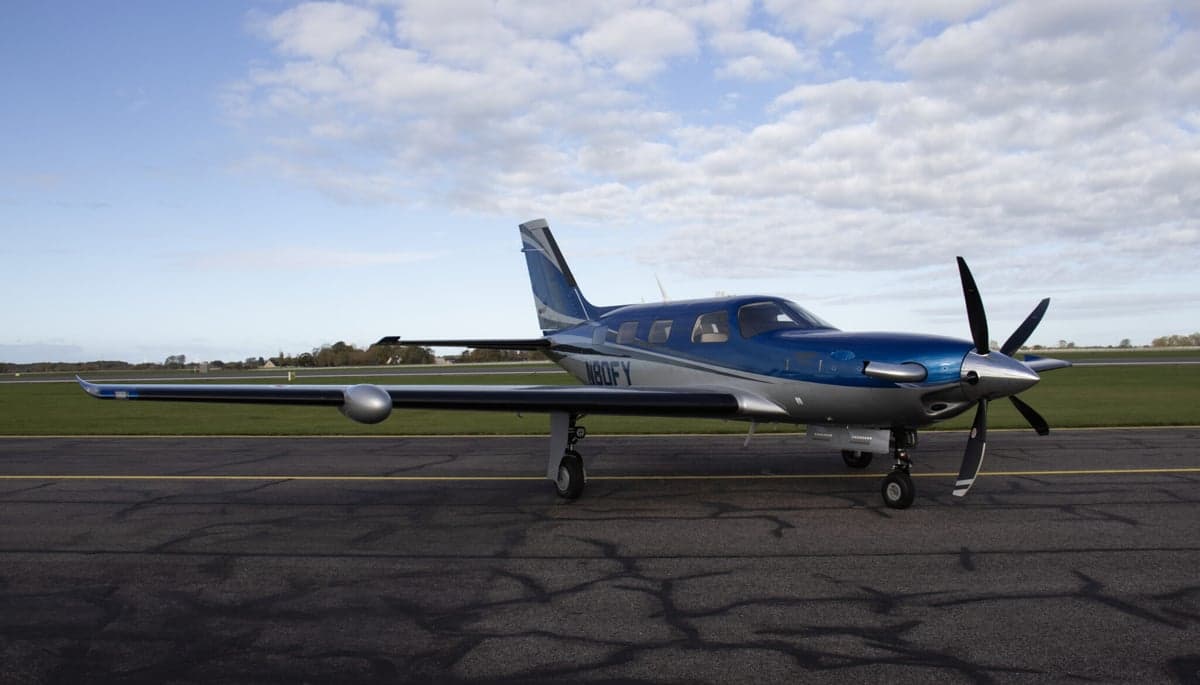N80FY Piper M600 parked on the tarmac with a blue and silver paint scheme.