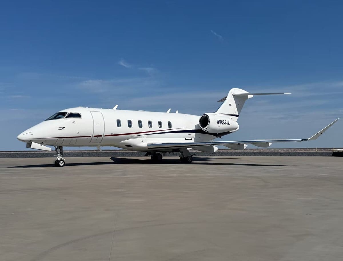 View of the Challenger 300 cockpit with instrument panel and seats.