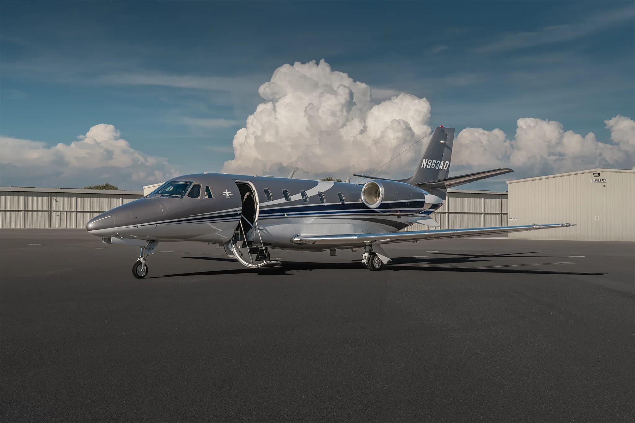Cessna Citation XLS+ aircraft on the tarmac with the door open.