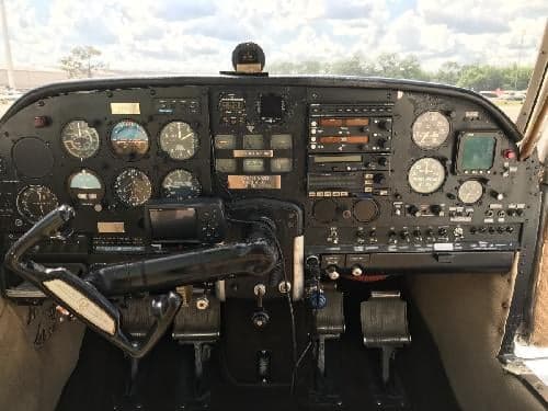 View of the aircraft's instrument panel and control yoke.