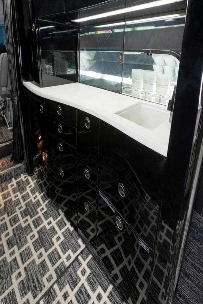 Close-up of the aircraft's galley area with a sink and storage.