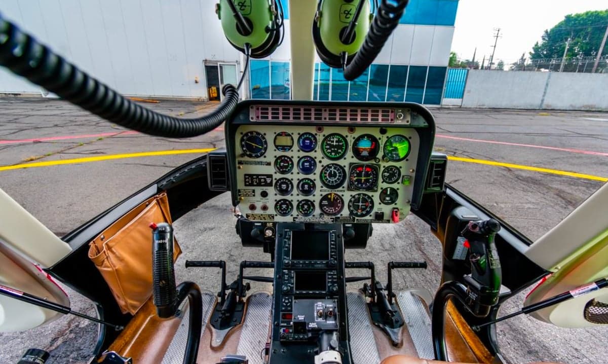 View of the instrument panel and controls in the cockpit of the helicopter.