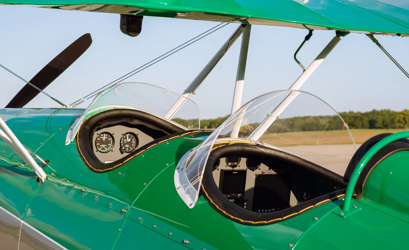 Close-up of the biplane's cockpit area with windshields.