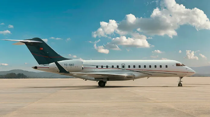 A white and gray jet aircraft with Turkish registration TC-SKC is parked on the tarmac.