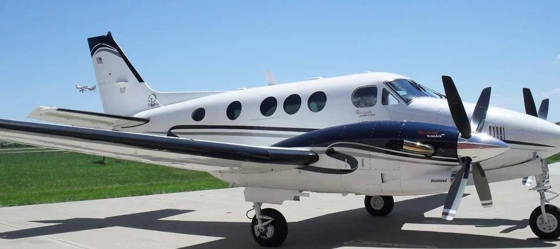 Side view of the Beechcraft King Air C90B aircraft on the ground.