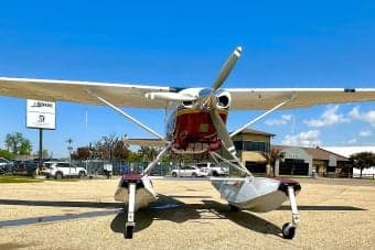 Front view of a float plane on the ground.