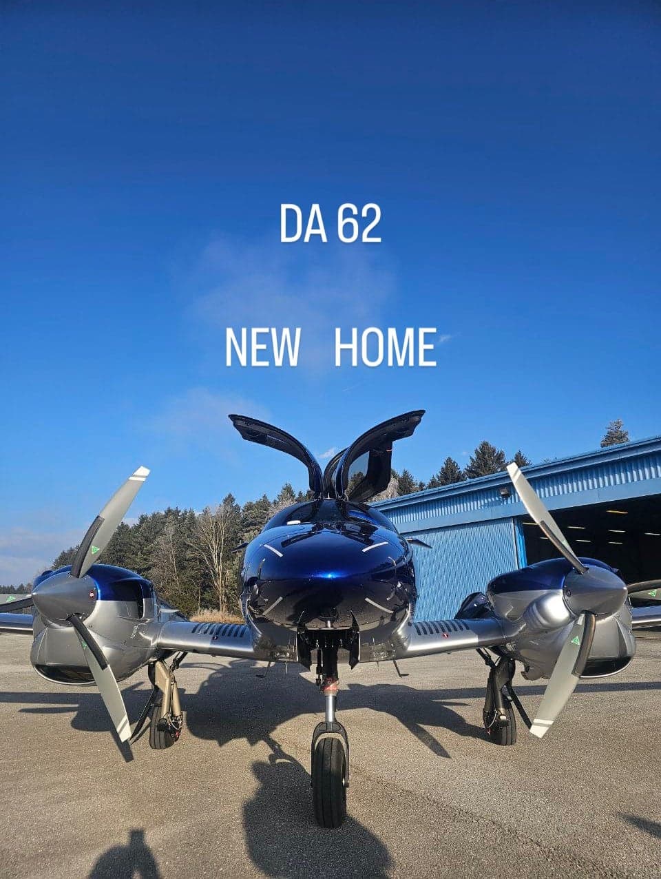 A DA62 aircraft is parked on the tarmac with its doors open.