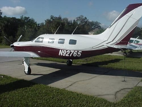 A Piper JetPROP aircraft with registration N92765 is parked on the tarmac.
