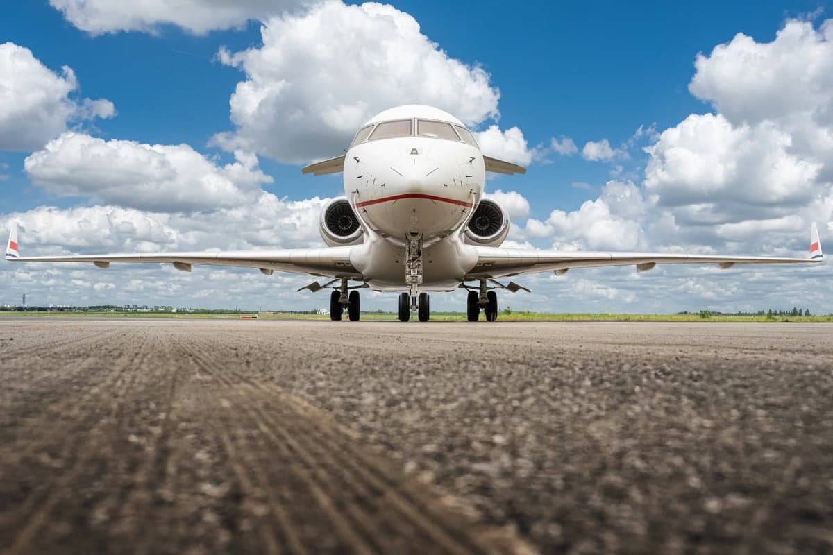 Front view of a Bombardier Global Express aircraft with registration N104AD on the tarmac.