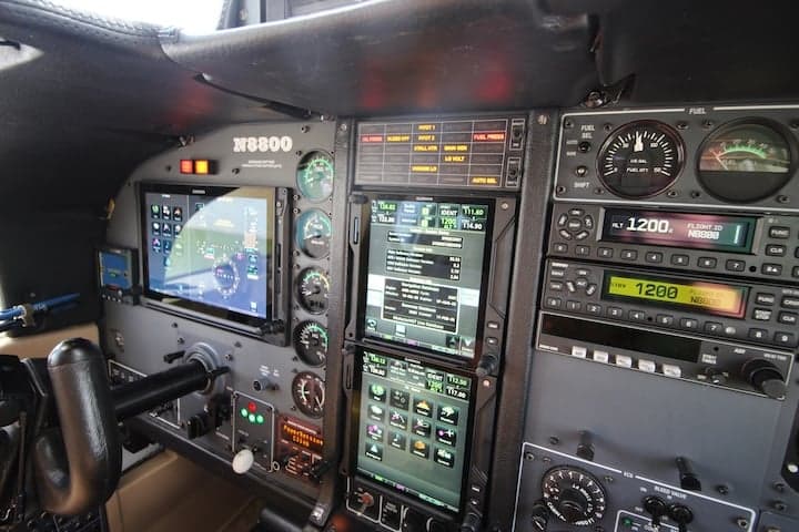 Detailed view of the aircraft's instrument panel with multiple displays and controls.