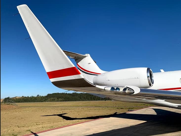Tail section and engine of the Embraer Legacy aircraft.