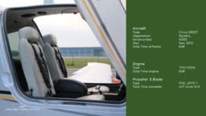 View of the interior of a Cirrus SR22T, showing the seats and aircraft specifications.