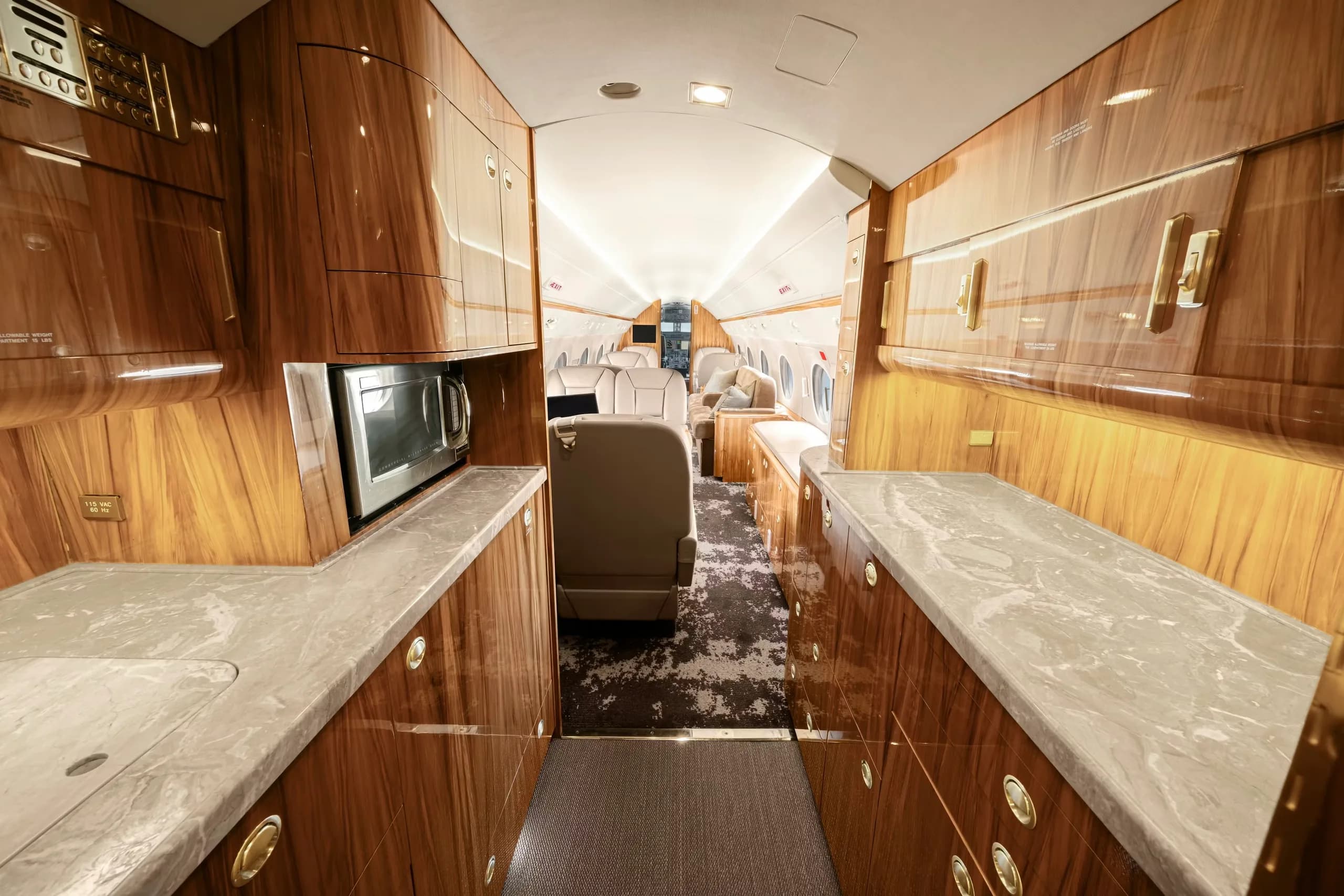 Interior view of the aircraft galley with a microwave and countertops.