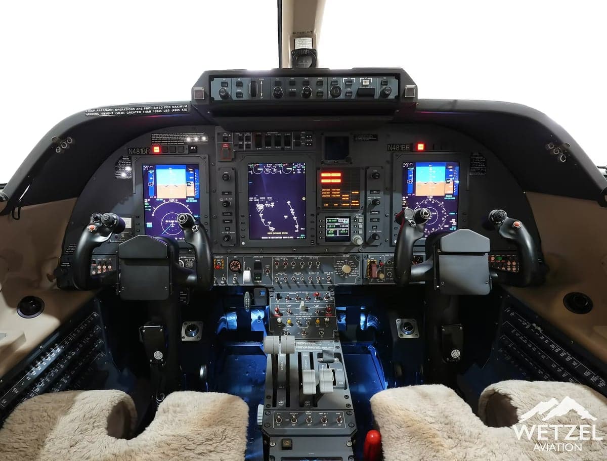 The cockpit of a Piaggio Avanti EVO features advanced avionics and comfortable seating.