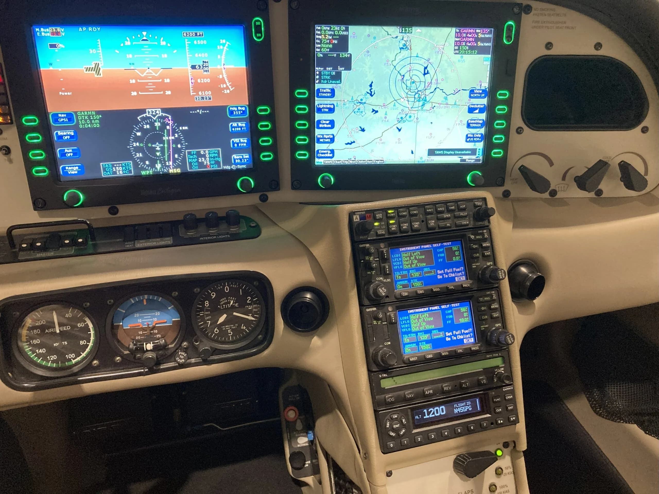 A detailed view of the Cirrus SR22 cockpit, showing the primary flight display, multifunction display, and avionics stack.