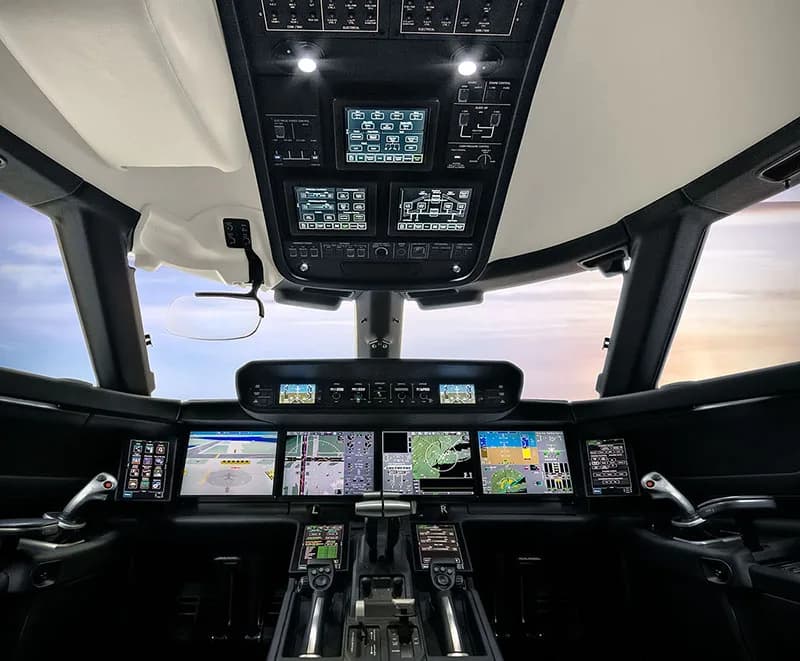 The cockpit of a Gulfstream jet with modern avionics.