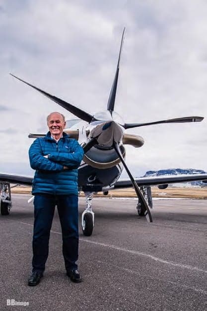 Man standing in front of a Pilatus PC-12 aircraft.