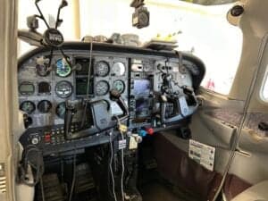 Full view of the Cessna 172 Skyhawk cockpit with various instruments and controls.