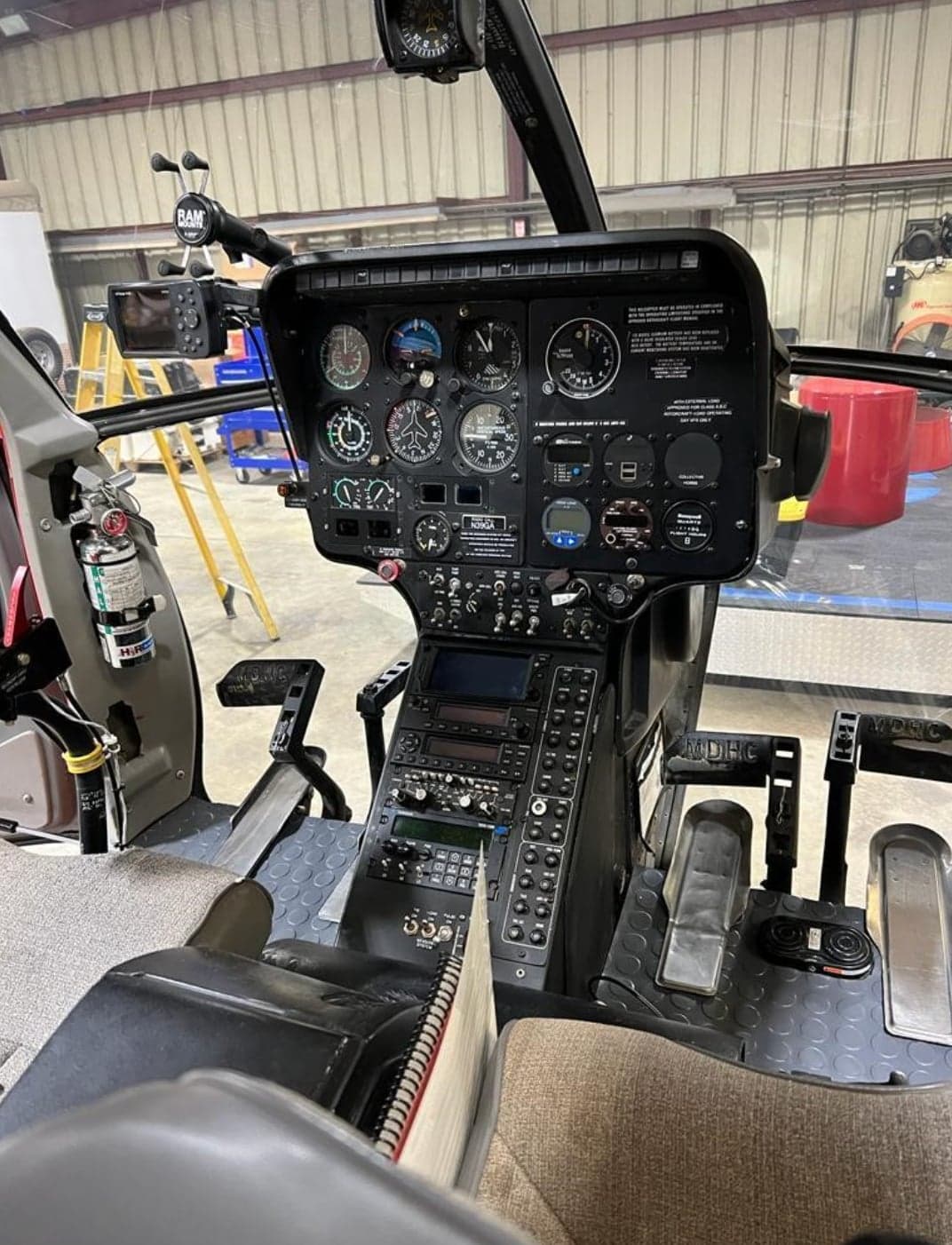 The instrument panel and controls inside the cockpit of the helicopter.