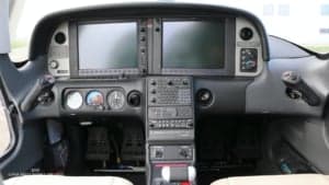 Detailed view of the cockpit instrument panel of a Cirrus SR22T aircraft.