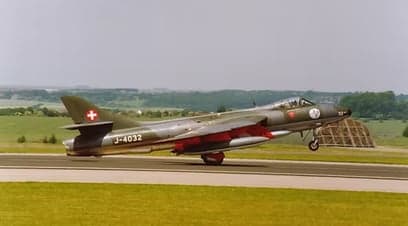Hawker Hunter J-4032 taxiing on a runway.
