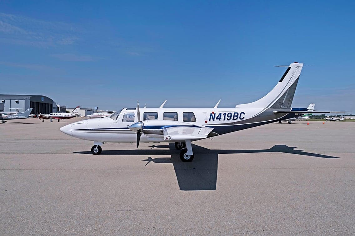 Aerostar aircraft N419BC parked on the tarmac with a white and gray paint scheme.