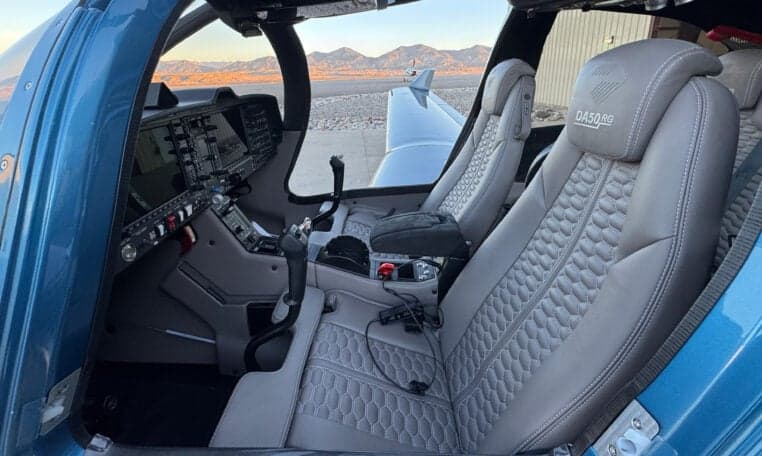 Interior view of the Diamond DA50 RG aircraft showing the seats and cockpit.
