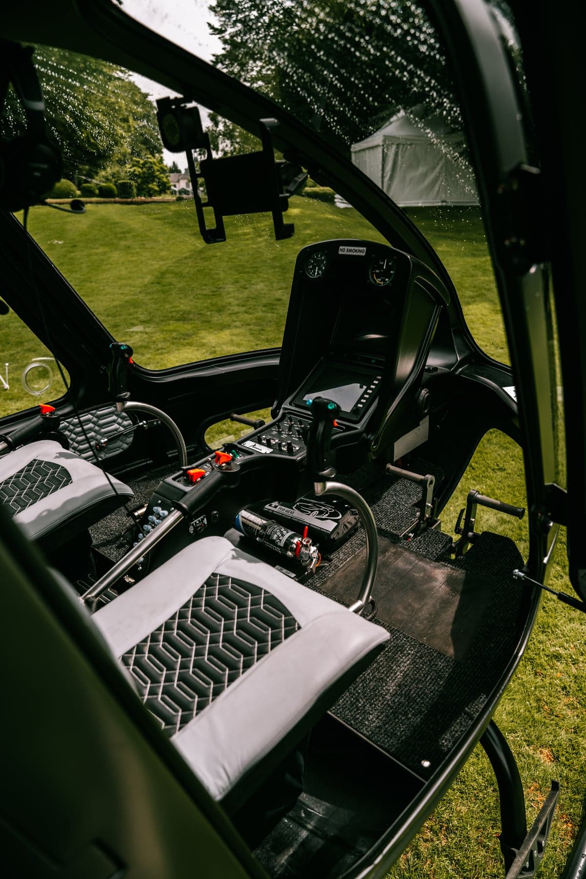 View of the helicopter cockpit and seats.