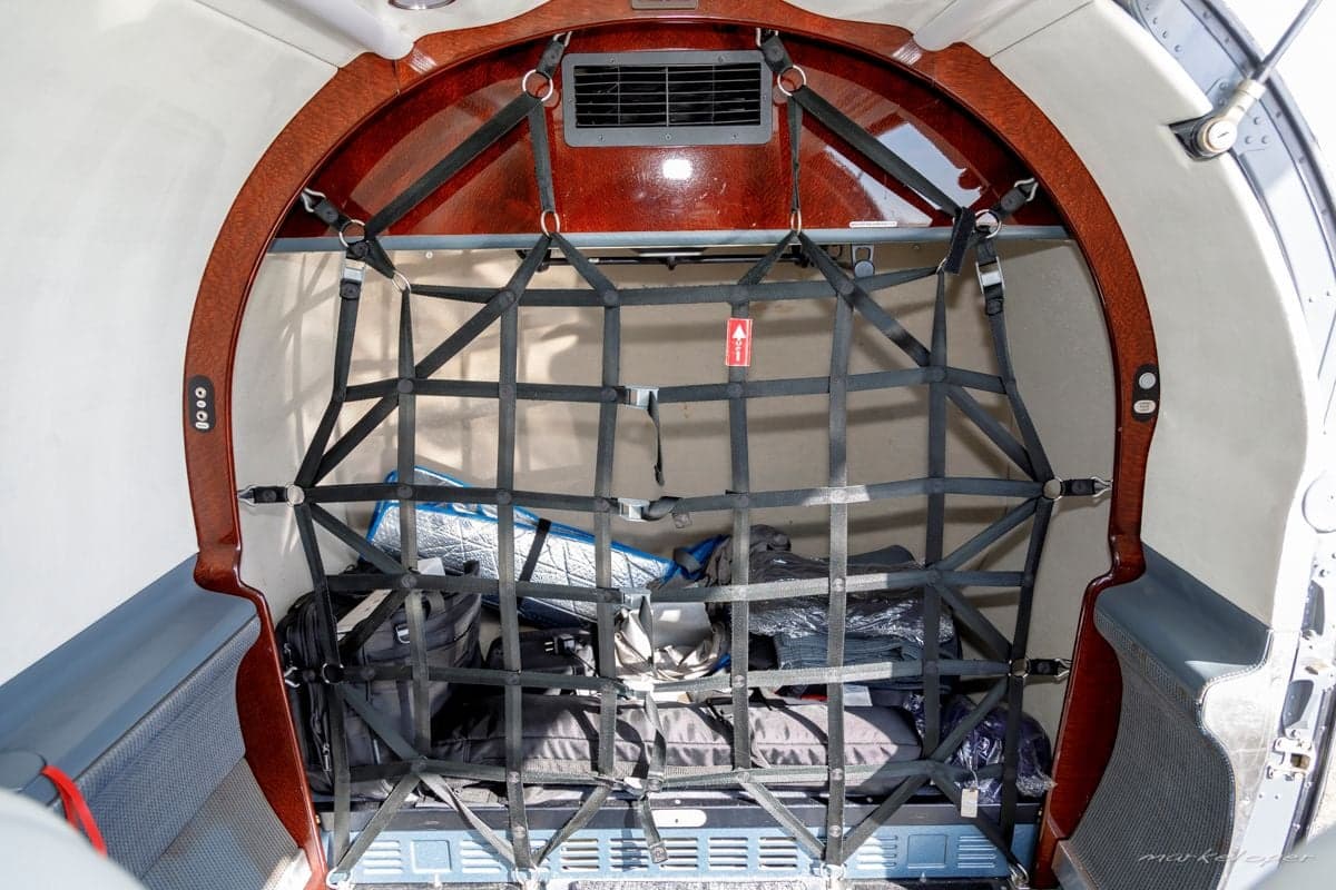 View of the Pilatus PC-12 cargo area with a cargo net.