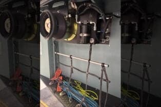 View of the helicopter's interior with equipment and storage.