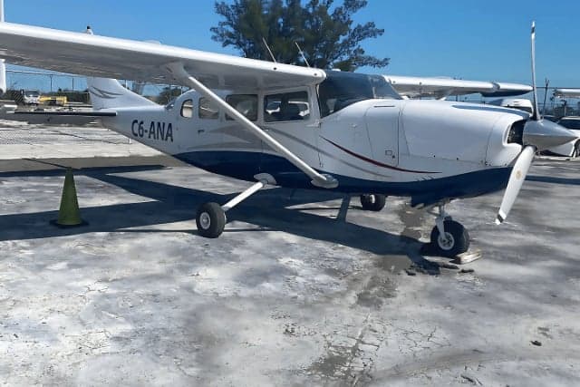 C6-ANA Cessna aircraft parked on the tarmac.