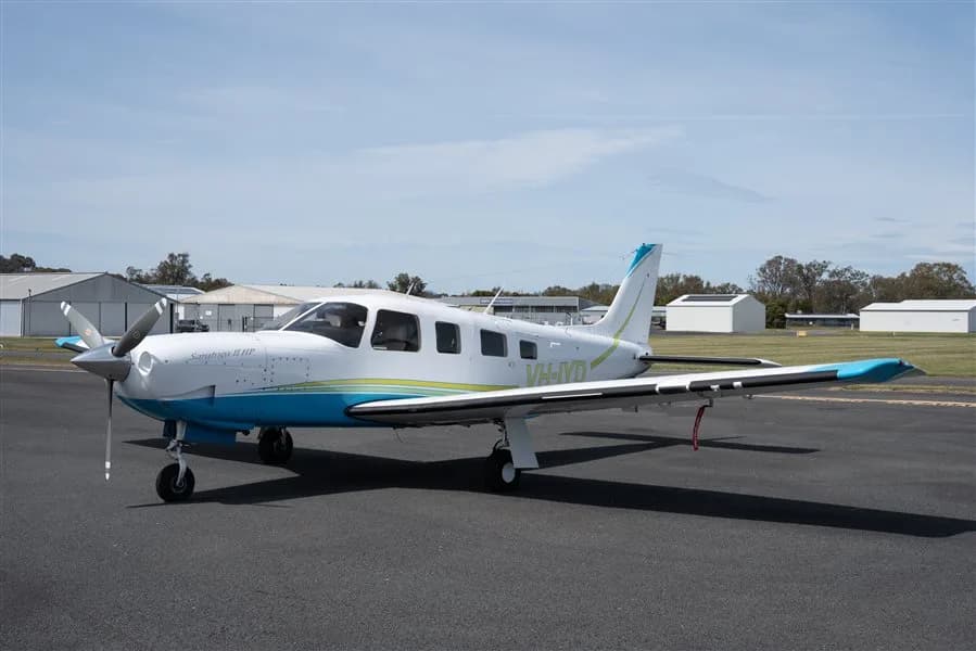 Piper Saratoga II HP on the tarmac with a white and blue paint scheme.